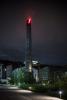 GOD'S MILLS (2019), Signal Festival Prague 2019, Prague (CZ) – Pavel Korbička, kinetic site-specific installation, chimney, LED technology, second hand of the clock, 300 cm, Corso Court complex, photo: Tomáš Slavík